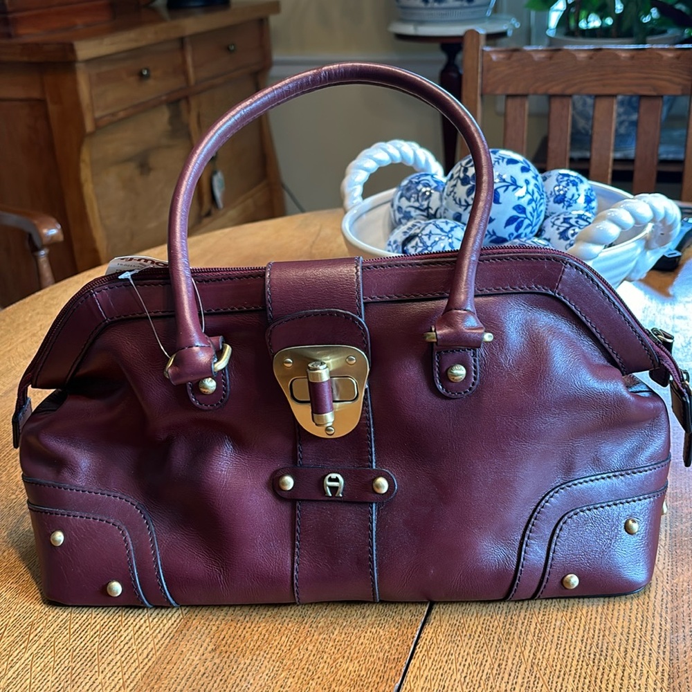 Etienne Aigner bag, signature burgundy color, outside zip pocket